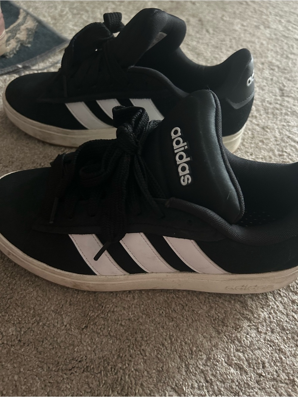 adidas women’s Black and White Low-Top Sneakers